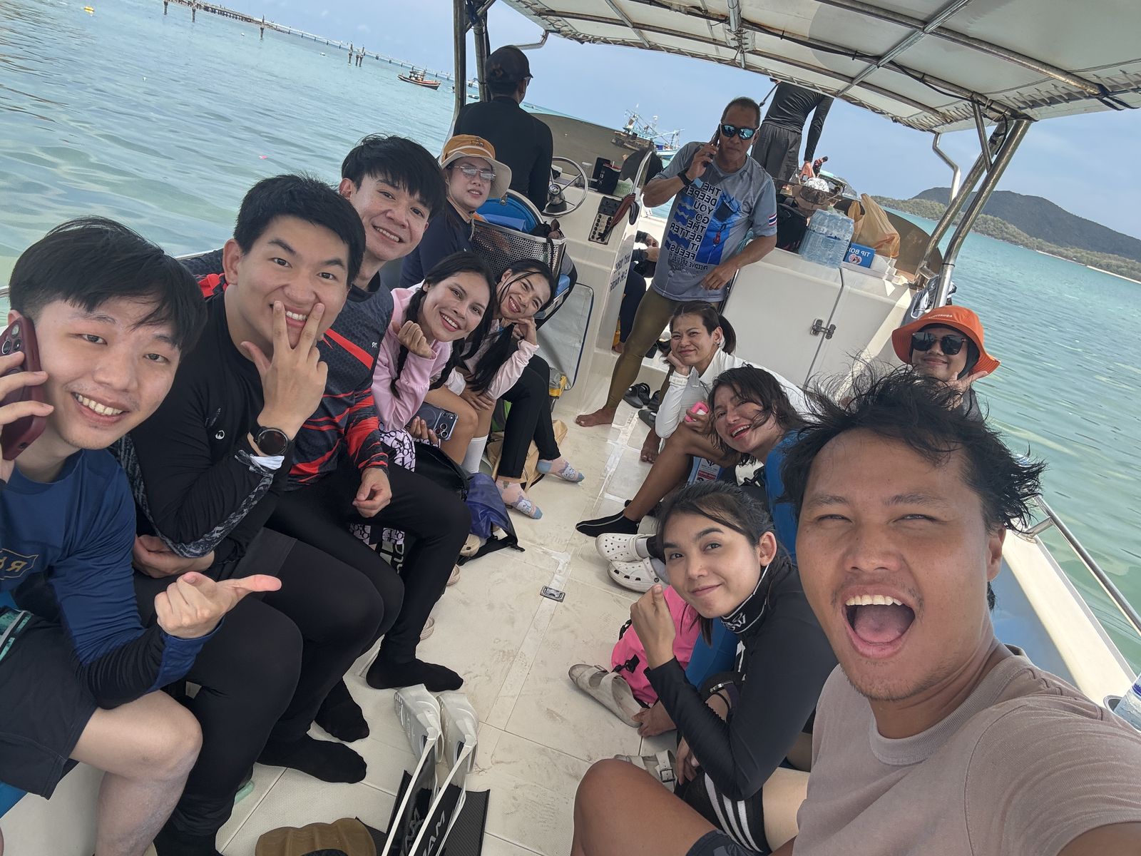 Freediver Journey students smiling together on a boat in Samae San